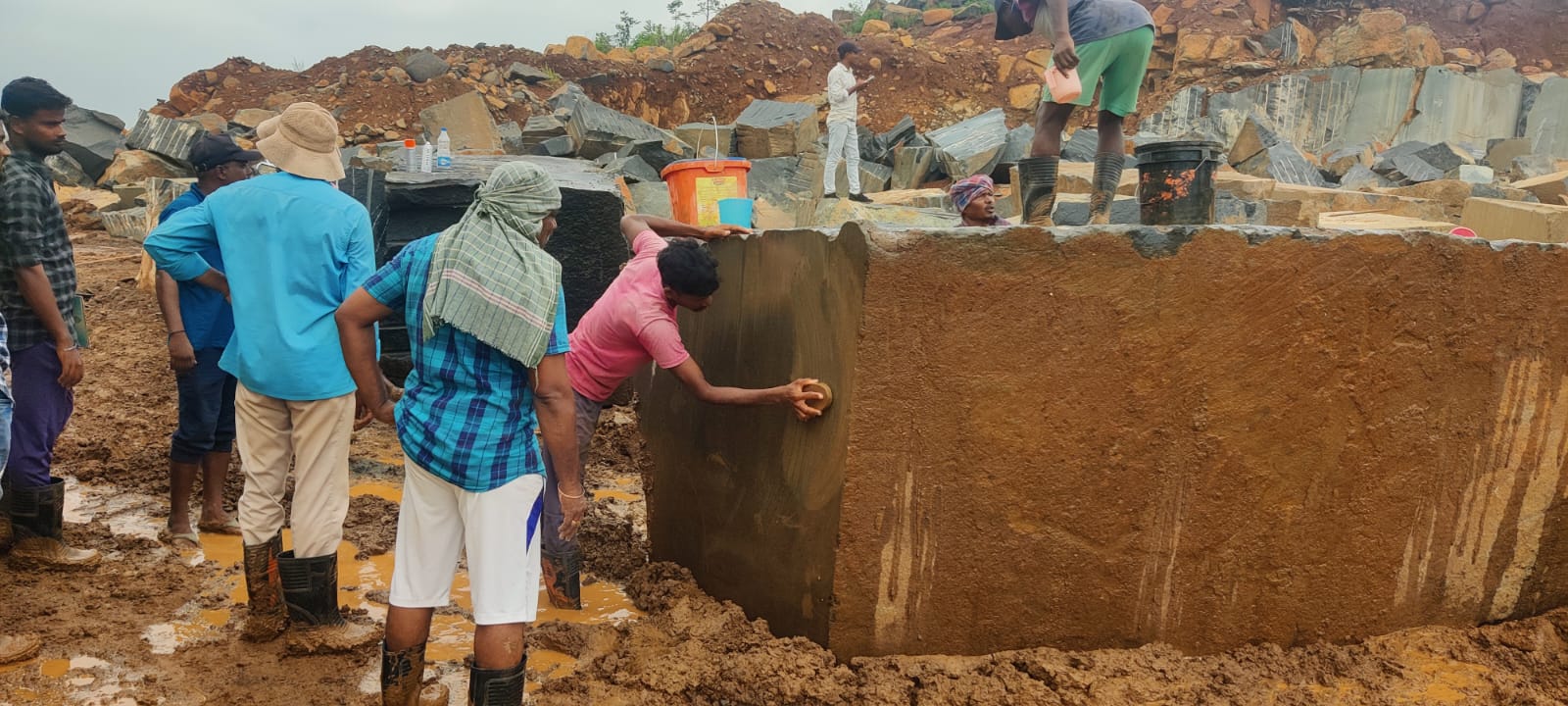 G-Axis team inspecting and dressing a granite block before shipment